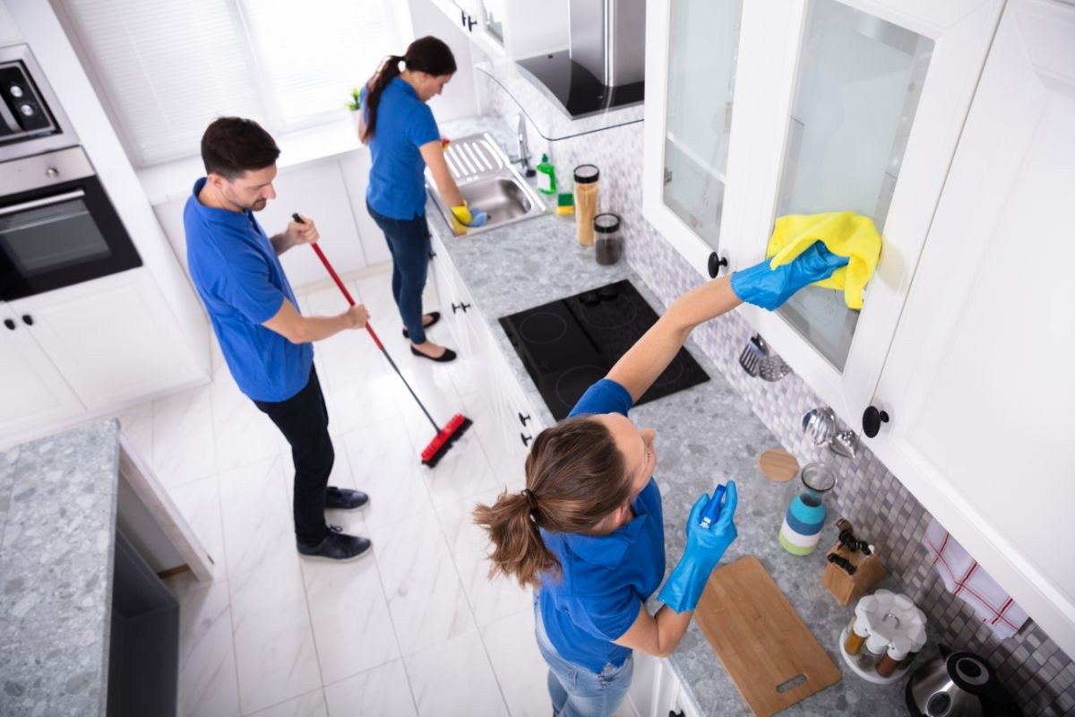 Professional domestic cleaner cleaning kitchen in Westminster flat